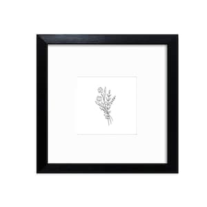 May include: A framed floral line art print. The artwork shows a delicate bouquet of flowers and leaves in black ink on a white background. The frame is square and black, with a white mount.