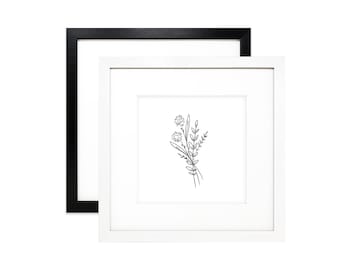 May include: A black and white line drawing of a bouquet of flowers in a white frame with a black outer frame.