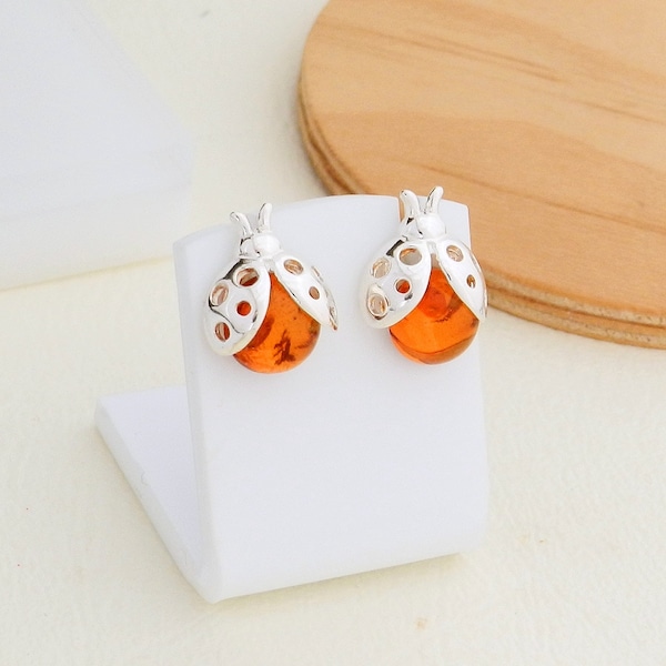 Boucles d'oreille coccinelles en ambre sur argent