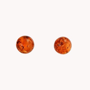 Amber ball earrings on silver