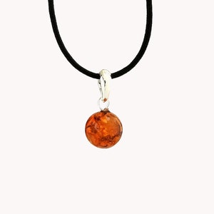 Amber and silver ball pendant
