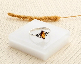 Silver and genuine amber ring