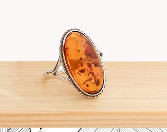 Silver and genuine amber ring