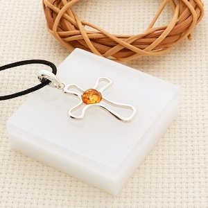 Amber and silver cross pendant