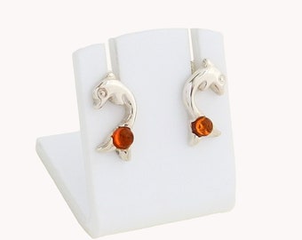 Amber dolphin earrings on silver