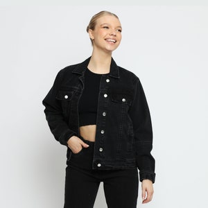 •	Black denim jacket with trucker wash. The jacket has a classic button, long sleeves, and two chest pockets. It is made of a soft, comfortable denim Jacket and has a relaxed fit. This jacket for Women is perfect for everyday wear down.