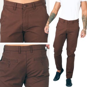 May include: Brown trousers with a button closure and pockets. The trousers are a solid colour and appear to be made of a durable fabric. The image shows the front and back of the trousers, as well as a person wearing them.