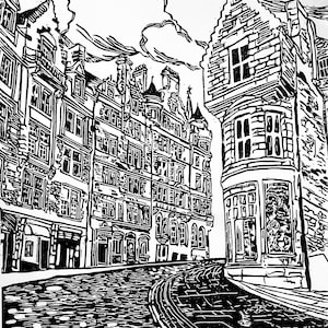 May include: Black and white woodcut print of a cobblestone street in Edinburgh, Scotland. The print features a row of buildings with tall windows and a corner building with a rounded bay window. The street is empty and the sky is cloudy.