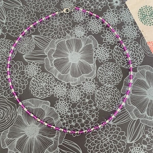Handmade necklace in small purple rock beads and large transparent rock beads