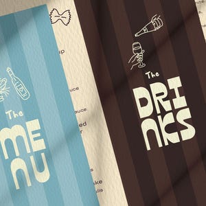 May include: Two menu cards with vertical stripes. One is light blue with "The MENU" in large white letters, and the other is brown with "The DRINKS" in large white letters. Both cards have food and drink illustrations.
