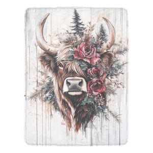 May include: A watercolor painting of a Highland cow with a floral crown of red roses. The cow is looking directly at the viewer with a soft expression. The background is a light gray with white paint splatters.