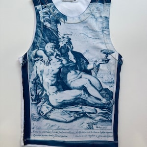 May include: White sleeveless tank top with a blue and white print of a Renaissance-era painting depicting a reclining couple. The print includes the text "Mutua Du wiret laus fi inodd fredera no&eacute;tunt, Ats Prikdom ente Eor haeren liefden vergan Oprutam parient homini fine lite Quidem. Ces down art begher".