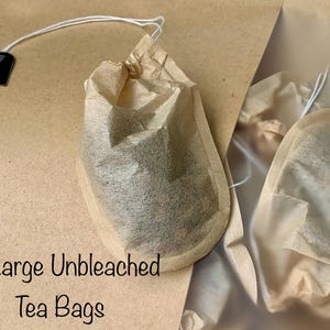 May include: Ten large unbleached tea bags in brown paper packaging. The tea bags are made of natural, unbleached paper and are ready to be used for brewing tea.