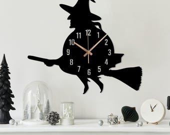 月の上で揺れる魔女のシルエットのハロウィーン調理鍋 - 振り子壁掛け