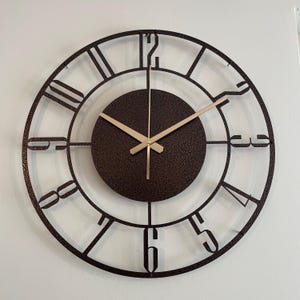 Metallic shine of bronze wall clock