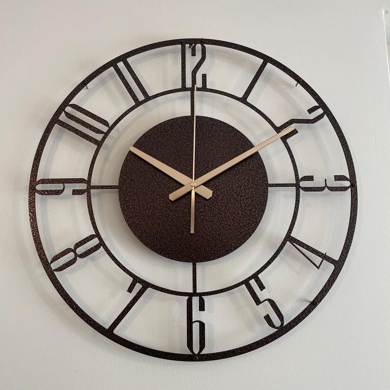 Metallic shine of bronze wall clock