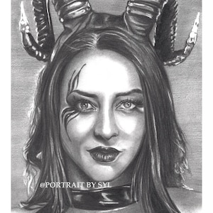 May include: A grayscale pencil portrait of a person with a horned headpiece and a choker. The portrait includes the artist's signature and the text "@PORTRAIT BY SYL". The person has dark hair and striking eye makeup, with a detailed rendering of the facial features.
