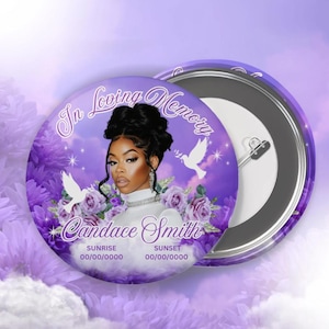 May include: A round memorial pinback button featuring a portrait of a person with dark hair, surrounded by purple flowers and white doves. The text reads In Loving Memory, Candace Smith, Sunrise 00/00/0000, and Sunset 00/00/0000 against a purple sky.