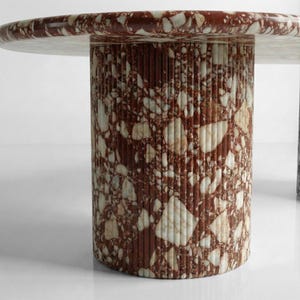 red bulgari marble dining table