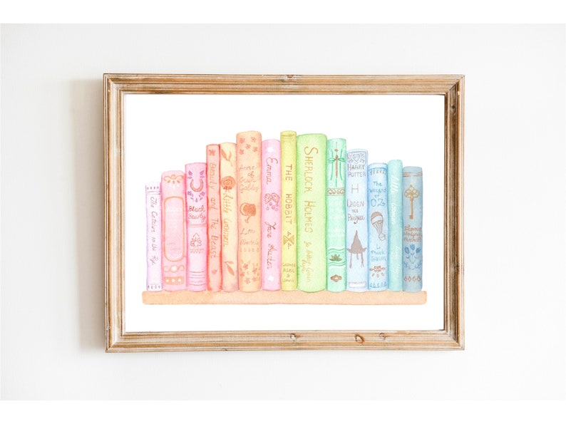 May include: A framed watercolour print depicting a row of books with titles such as "Emma", "The Hobbit", and "Sherlock Holmes". The books are arranged on a shelf, with pastel-coloured spines. The artwork is framed in a wooden frame, suitable for a home library.