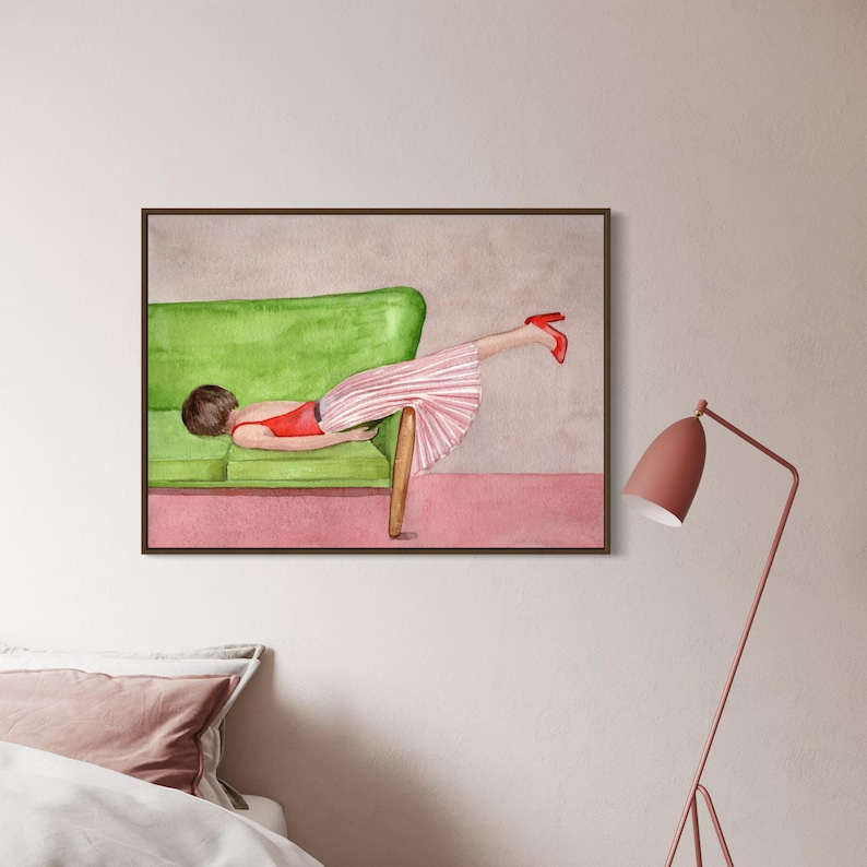 May include: Watercolor painting of a person lying on a green sofa, wearing a red top and a pink and white striped skirt. Red high heels are visible. The artwork is framed in a brown frame.