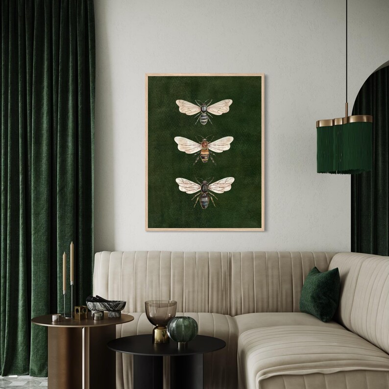 May include: A rectangular wall art print in a light wood frame featuring three detailed illustrations of bees arranged vertically against a solid, dark forest green background. Each bee is depicted with translucent wings and brown bodies.
