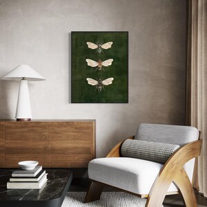 May include: A rectangular wall art print featuring three detailed illustrations of bees arranged vertically. The bees are depicted with brown and black bodies and translucent wings, set against a solid, dark forest green background.