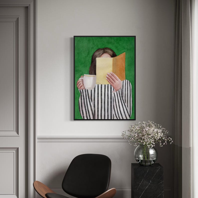May include: A watercolor painting of a person holding a book in front of their face and a cup of coffee in their other hand. The person is wearing a black and white striped shirt and is standing in front of a green background.