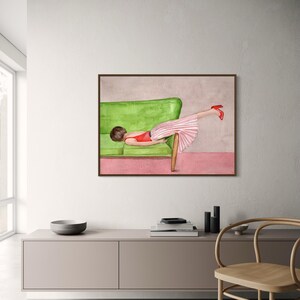 May include: Watercolor painting of a person reclining on a green sofa, wearing a red top, a pink and white striped skirt, and red heels. The artwork is framed in a brown wooden frame, with a pink and gray background.