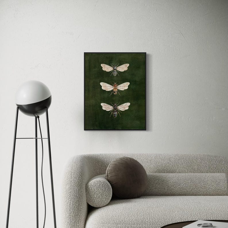 May include: A rectangular wall art print featuring three detailed illustrations of bees arranged vertically. The bees are depicted with tan and brown bodies and translucent wings, set against a solid, dark forest green background.
