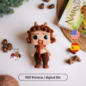 May include: A crocheted doll of a mythical creature with brown hair, beard, and horns, wearing a red scarf. The doll is set against a white background with acorns and a book. The text "PDF Pattern / digital file" is at the bottom.