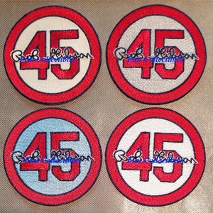 May include: Four red, white, and blue embroidered patches with the number "45" in red and the text "Bob's Collectibles" in blue.