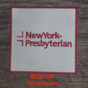 May include: White iron-on patch with red embroidered text that reads "New York-Presbyterian".