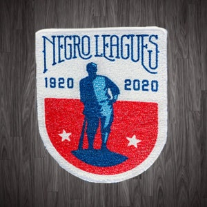 May include: White patch with a red, white, and blue design. The patch features a silhouette of a baseball player with a bat and the text "Negro Leagues 1920 2020".