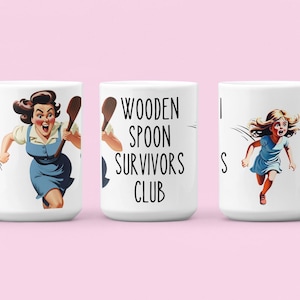 May include: Three white ceramic mugs with a humorous design. The mug on the left features a woman running with a wooden spoon. The mug in the center has the text "Wooden Spoon Survivors Club". The mug on the right features a woman running with a scared expression.