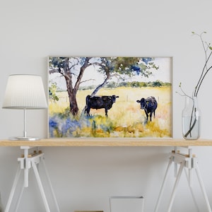 May include: Watercolour painting of two black cows standing in a field with a tree in the background.