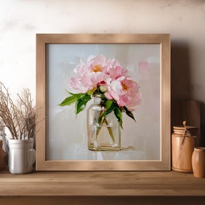 May include: A framed floral painting featuring pink peonies in a clear glass vase. The artwork has a light background and a wooden frame. The painting captures the delicate beauty of the flowers.