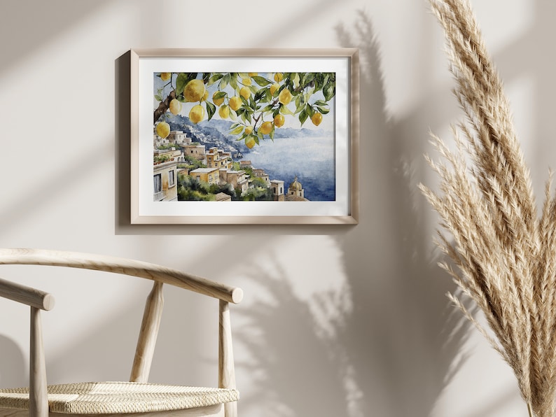 May include: Watercolor painting of a lemon tree with ripe yellow lemons hanging from the branches. The tree is in the foreground, with a view of a coastal town and the sea in the background.