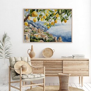 May include: Watercolor painting of a lemon tree with ripe yellow lemons hanging from the branches. The tree is in front of a picturesque Italian village with colorful buildings and a blue sea in the background.