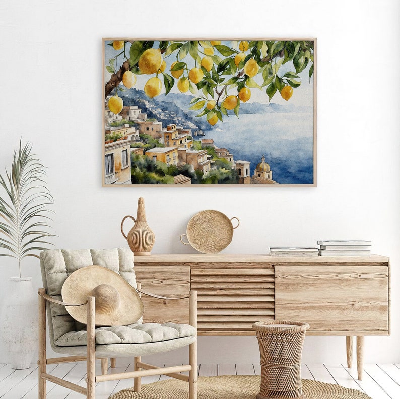 May include: Watercolor painting of a lemon tree with ripe yellow lemons hanging from the branches. The tree is in front of a picturesque Italian village with colorful buildings and a blue sea in the background.