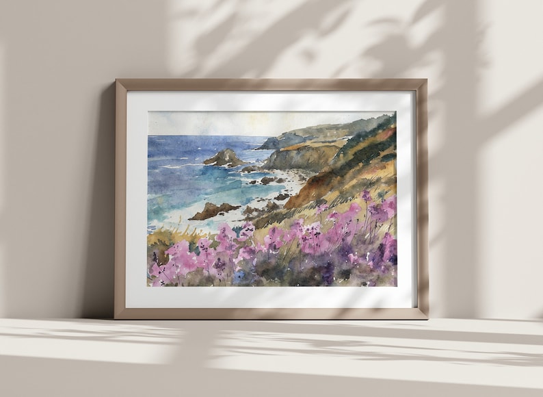 May include: Watercolor painting of a coastal scene with a rocky cliff, ocean waves, and purple wildflowers in the foreground.