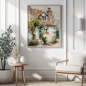 May include: Watercolor painting of a small, white cottage with a brown roof and green vines growing up the side. The cottage has two windows and a chimney. The painting is set against a background of green trees and a blue sky.