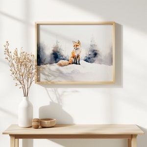 May include: A watercolor painting of a red fox sitting in a snowy forest. The fox is looking to the right, and its tail is curled around its body. The background is a soft blue and white, with trees and snow.
