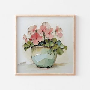 Op de afbeelding: Een ingelijst schilderij van een bloemstilleven. Het kunstwerk toont een lichtgroene vaas gevuld met roze bloemen en groene bladeren. Het schilderij heeft een textuurrijke, impressionistische stijl, met zichtbare penseelstreken. De lijst is licht van kleur.