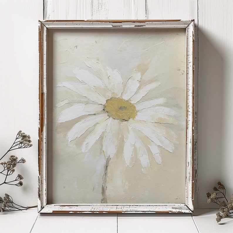 May include: A framed painting of a white daisy with a yellow center on a cream background.