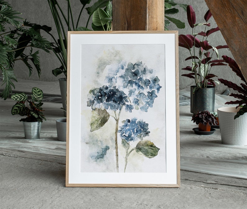 May include: A watercolor painting of blue hydrangeas on a white background with a wooden frame.