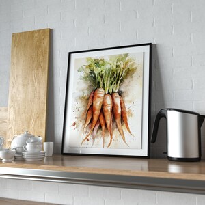 May include: A framed watercolor print of carrots with green tops. The artwork features orange carrots with green leaves, displayed in a black frame. The print is on a wooden shelf with a white brick wall background.