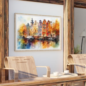 May include: A watercolor painting of a canal scene in Amsterdam, Netherlands. The painting features colorful buildings with red tile roofs, a canal with boats, and trees with fall foliage.