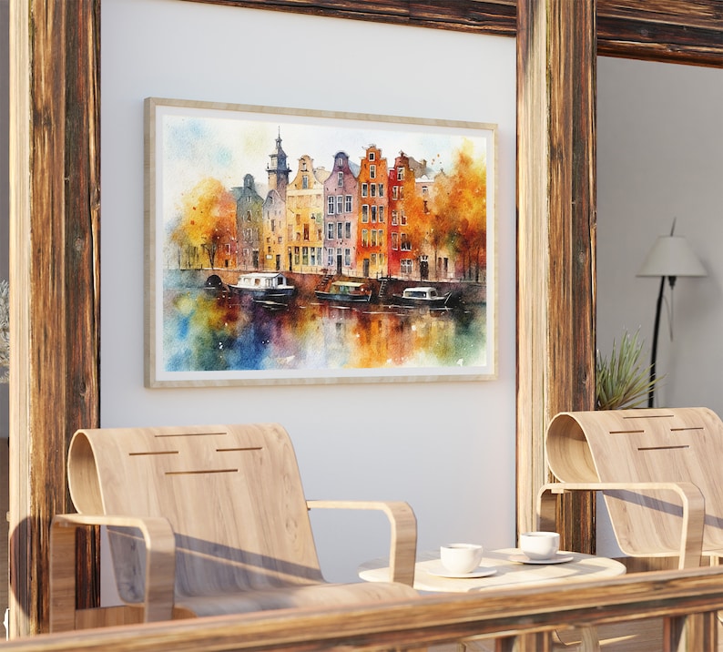 May include: A watercolor painting of a canal scene in Amsterdam, Netherlands. The painting features colorful buildings with red tile roofs, a canal with boats, and trees with fall foliage.