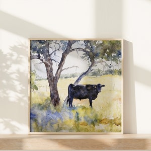 May include: Watercolour painting of a black cow standing in a field under a large tree with green leaves. The background is a soft yellow and blue.